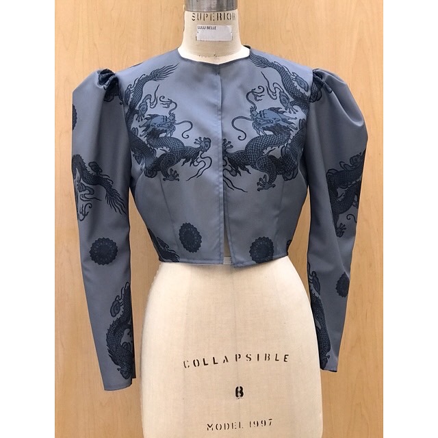 Shows front view of the final garment with dragons on the left and right side of the bodice front facing each other. 