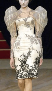 A model wearing a princess sleeved dress with internal armature by Alexander McQueen from 2007