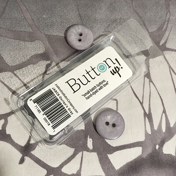 Button Up! Packaging and 2 of the Dorian's Gray buttons that I used. 