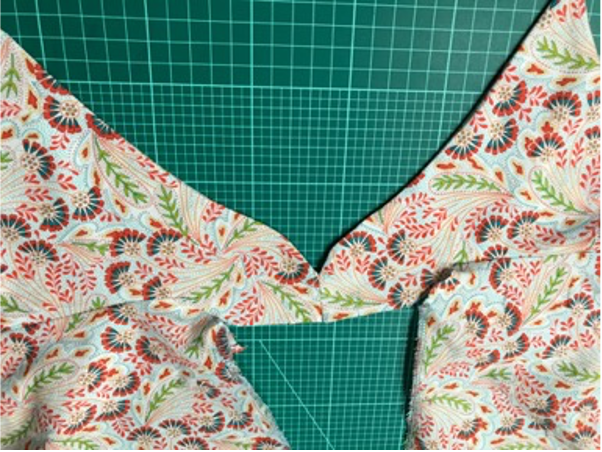 The collar join layed out flat on a cutting matt.