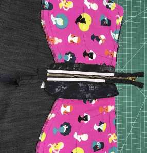 Front legs of jean viewed from wrong side. Shows pockets and zipper. 