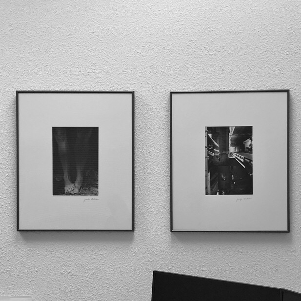 2 Black and White photographs hang on another wall